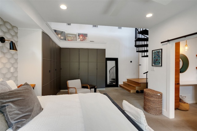 2502 Side Cv, Austin, TX 78704 - bedroom with a barn door and recessed lighting