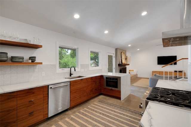 2502 Side Cv, Austin, TX 78704 - kitchen featuring stainless steel appliances, a sink, brown cabinets, recessed lighting, and modern cabinets