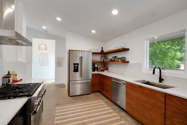 2502 Side Cv, Austin, TX 78704 - kitchen with stainless steel appliances, wall chimney range hood, a sink, brown cabinetry, and recessed lighting