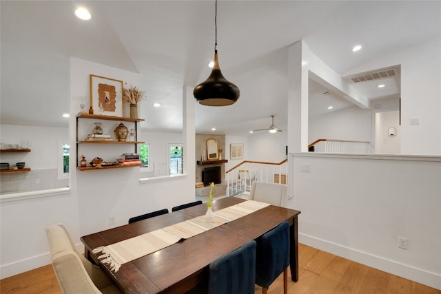 2502 Side Cv, Austin, TX 78704 - dining room featuring a ceiling fan, light wood-style floors, recessed lighting, baseboards, and vaulted ceiling