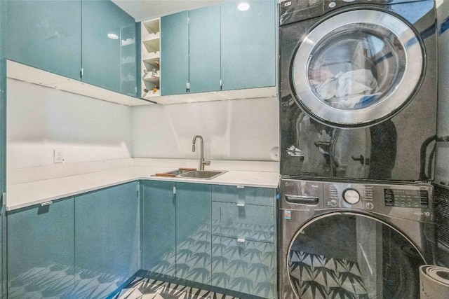 2502 Side Cv, Austin, TX 78704 - laundry room featuring stacked washer / drying machine and cabinet space