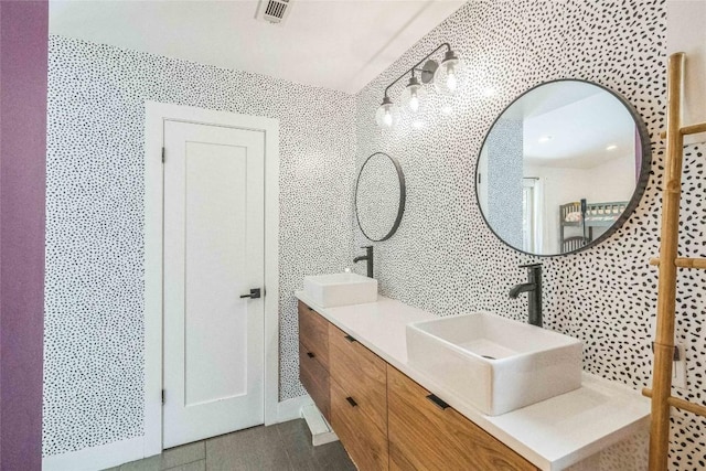 2502 Side Cv, Austin, TX 78704 - full bathroom featuring tile walls, double vanity, and backsplash
