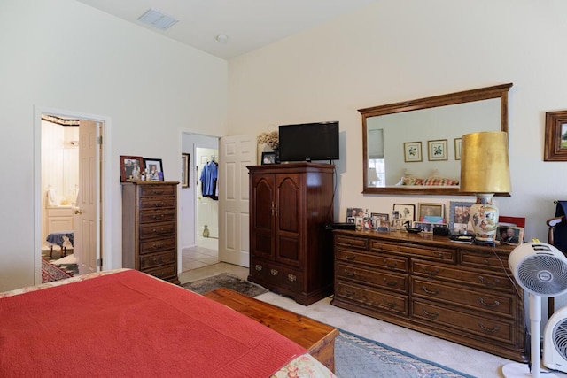 bedroom featuring light colored carpet
