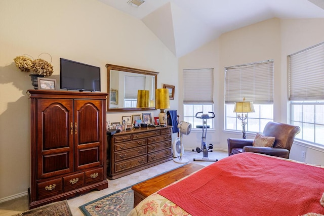 bedroom with vaulted ceiling, baseboards, and light colored carpet