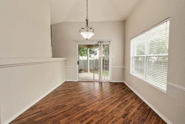 16710 Shipshaw River Dr, Leander, TX 78641 - unfurnished dining area with dark wood finished floors, vaulted ceiling, and baseboards