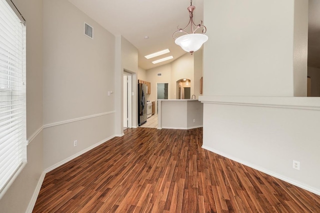 16710 Shipshaw River Dr, Leander, TX 78641 - empty room featuring vaulted ceiling, wood finished floors, and baseboards