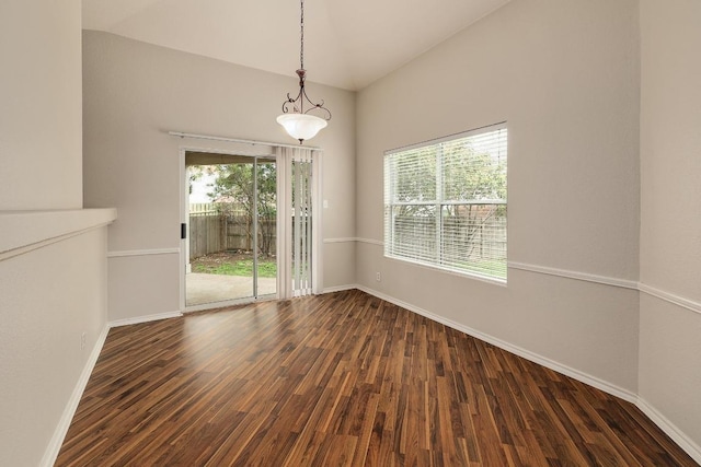 unfurnished room with baseboards, dark wood-type flooring, and high vaulted ceiling