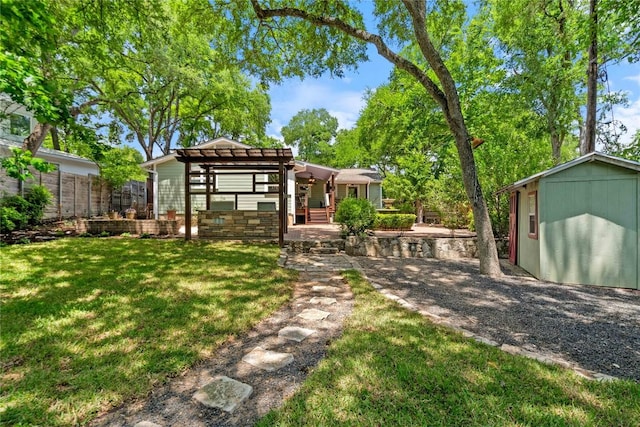 2601 W 49th St, Austin, TX 78731 - view of green lawn with a storage unit and an outbuilding