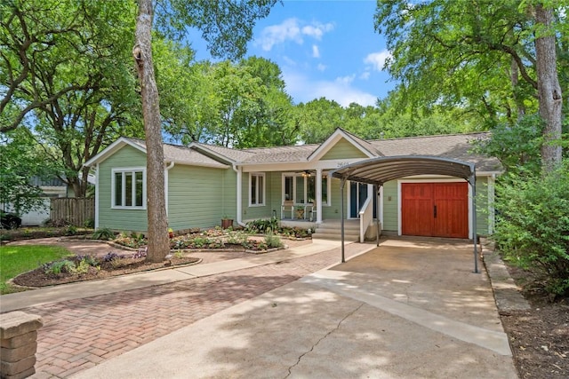 2601 W 49th St, Austin, TX 78731 - single story home with driveway, a porch, a ceiling fan, a carport, and a shingled roof
