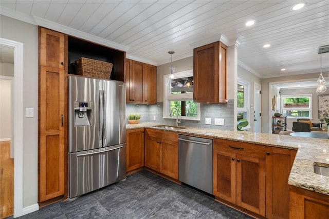 2601 W 49th St, Austin, TX 78731 - kitchen with stainless steel appliances, brown cabinetry, plenty of natural light, recessed lighting, and ornamental molding
