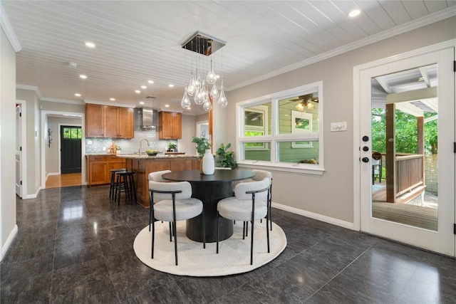 2601 W 49th St, Austin, TX 78731 - dining area featuring baseboards, recessed lighting, crown molding, and a chandelier