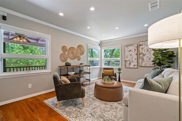 2601 W 49th St, Austin, TX 78731 - living room with wood finished floors, baseboards, crown molding, recessed lighting, and ceiling fan