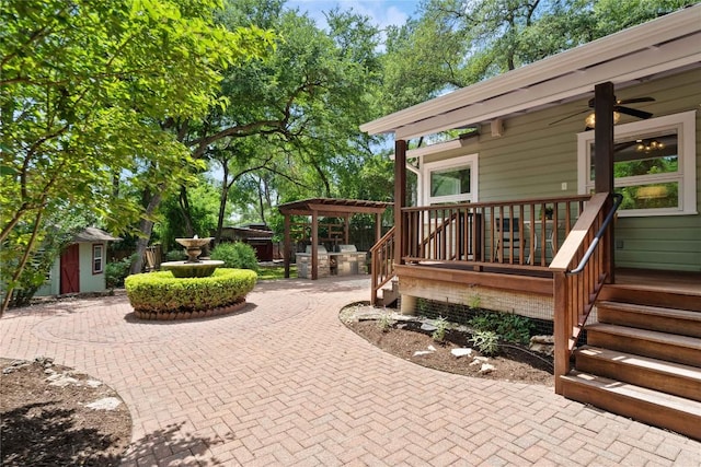 2601 W 49th St, Austin, TX 78731 - view of patio / terrace with fence, ceiling fan, an outdoor structure, and a storage shed