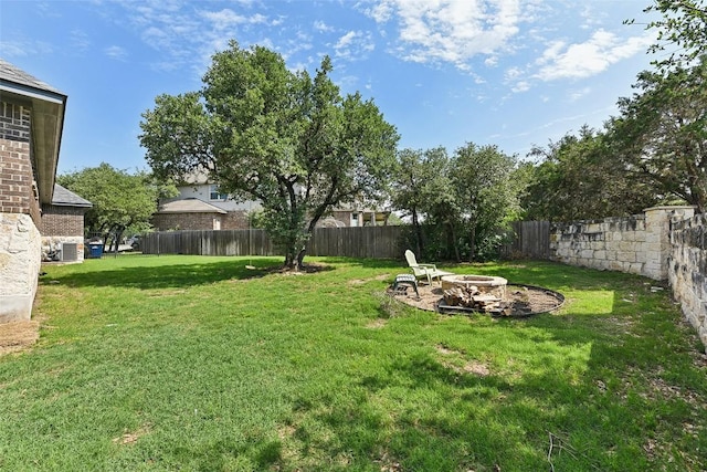 125 Redtail Ln, Leander, TX 78641 - view of yard with an outdoor fire pit and central AC