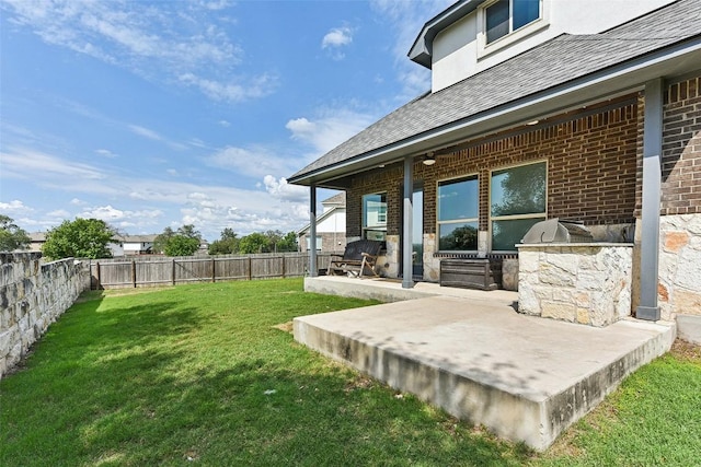 125 Redtail Ln, Leander, TX 78641 - view of yard featuring an outdoor kitchen and a patio