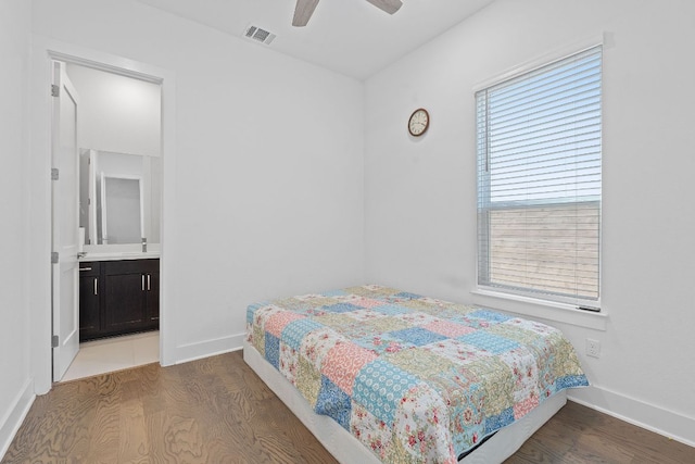 1616 Illawarra Way, Leander, TX 78641 - bedroom with wood finished floors, baseboards, connected bathroom, and ceiling fan