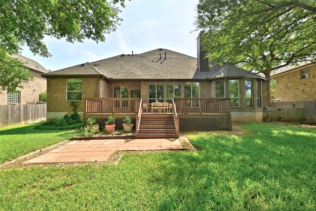 1607 Mesa Verde Dr, Round Rock, TX 78681 - rear view of house with brick siding, a patio area, a deck, a shingled roof, and a chimney