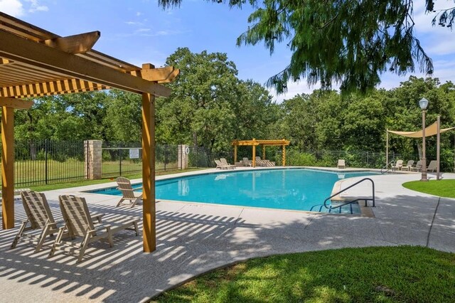 1607 Mesa Verde Dr, Round Rock, TX 78681 - community pool with a pergola, a patio area, and view of wooded area