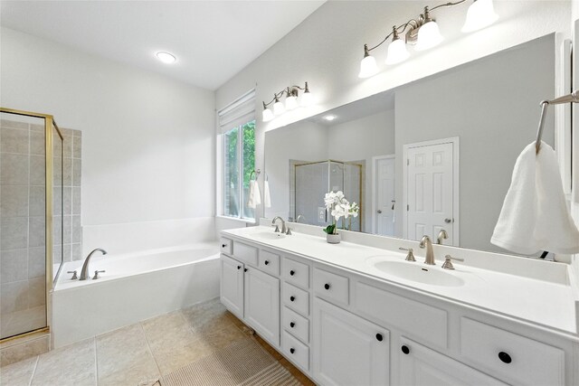 1607 Mesa Verde Dr, Round Rock, TX 78681 - full bathroom with double vanity, a shower stall, a bath, and tile patterned flooring