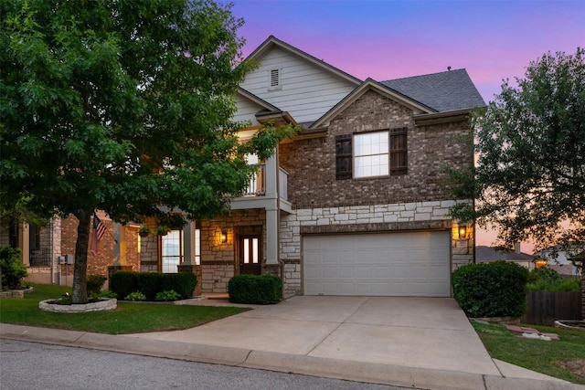 361 Stone View Trl, Austin, TX 78737 - view of front of house featuring a garage, concrete driveway, stone siding, and brick siding