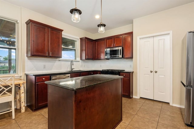361 Stone View Trl, Austin, TX 78737 - kitchen with appliances with stainless steel finishes, a sink, reddish brown cabinets, tasteful backsplash, and light tile patterned floors