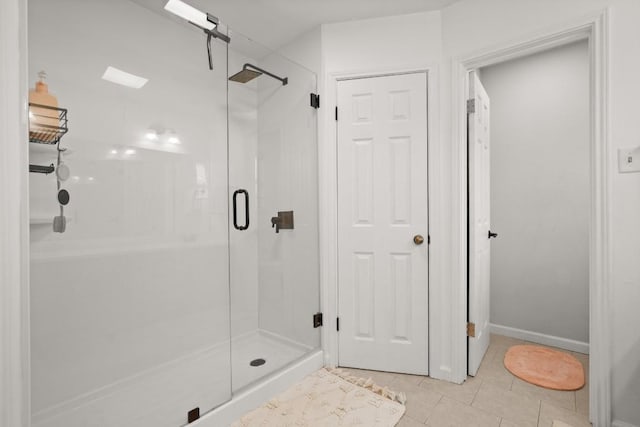 3312 Monument Dr, Round Rock, TX 78681 - bathroom with a shower stall, tile patterned flooring, and baseboards
