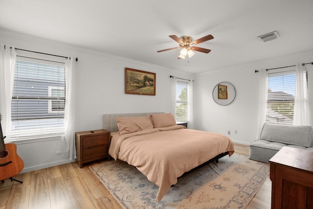 3312 Monument Dr, Round Rock, TX 78681 - bedroom featuring light wood-type flooring, baseboards, ceiling fan, and ornamental molding