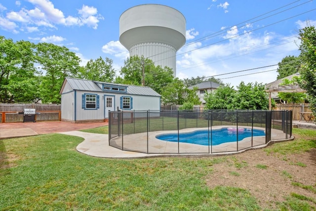 3312 Monument Dr, Round Rock, TX 78681 - view of swimming pool with a grill, a patio, and an outbuilding