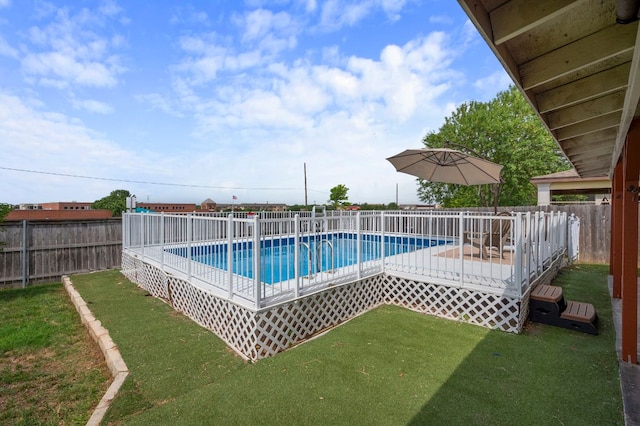 view of swimming pool with a deck