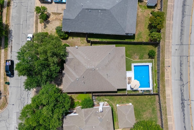 aerial view of property and surrounding area with a pool area