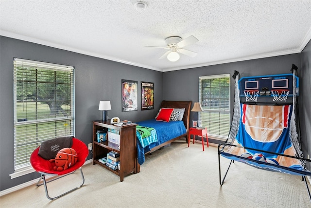 bedroom featuring carpet, ornamental molding, a textured ceiling, baseboards, and a ceiling fan