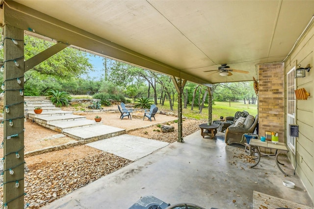 view of patio / terrace featuring a fire pit and ceiling fan