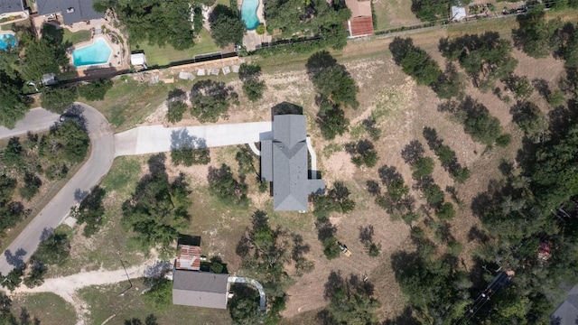 aerial view of property's location featuring a pool