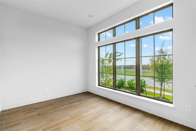 639 Bay Breeze Dr, Kyle, TX 78640 - empty room featuring baseboards and wood finished floors