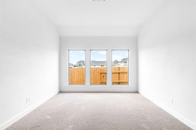 639 Bay Breeze Dr, Kyle, TX 78640 - carpeted spare room featuring baseboards and lofted ceiling