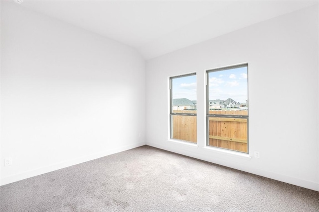 639 Bay Breeze Dr, Kyle, TX 78640 - carpeted empty room with vaulted ceiling and baseboards