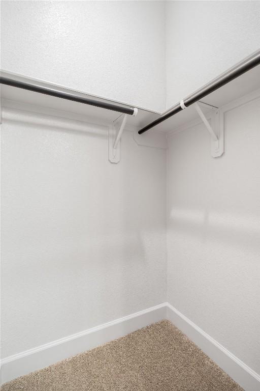 639 Bay Breeze Dr, Kyle, TX 78640 - walk in closet featuring carpet