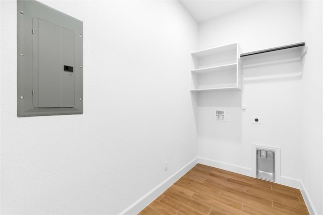 639 Bay Breeze Dr, Kyle, TX 78640 - laundry area featuring hookup for a gas dryer, electric panel, washer hookup, hookup for an electric dryer, and light wood-type flooring