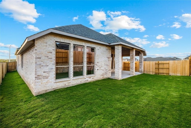 639 Bay Breeze Dr, Kyle, TX 78640 - rear view of property featuring a patio area and roof with shingles