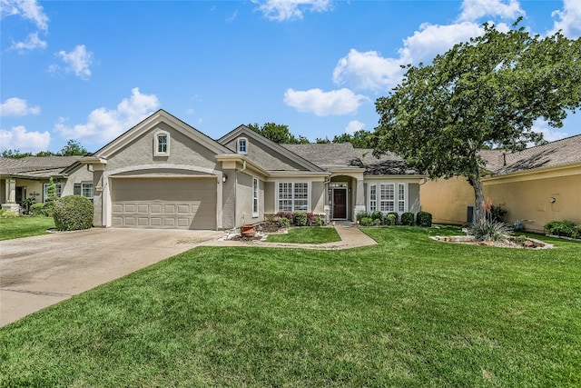 710 Breezeway Ln, Georgetown, TX 78633 - view of front of property with concrete driveway, stucco siding, a front lawn, and an attached garage