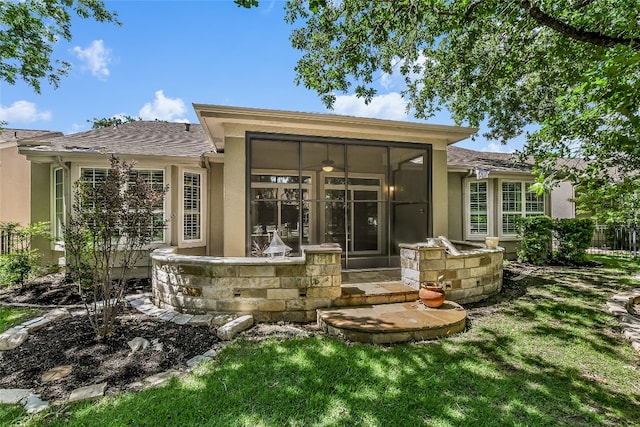 710 Breezeway Ln, Georgetown, TX 78633 - rear view of property with stucco siding and a sunroom