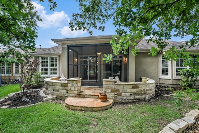 710 Breezeway Ln, Georgetown, TX 78633 - rear view of property featuring stucco siding, a sunroom, and fence