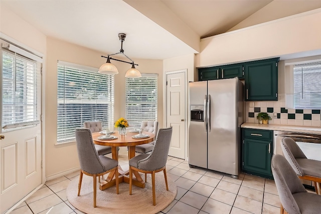 17904 Worley Dr, Pflugerville, TX 78660 - dining space featuring light tile patterned floors, plenty of natural light, and vaulted ceiling