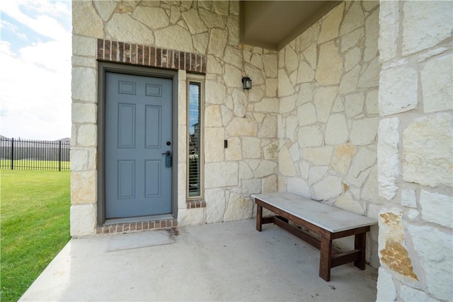 entrance to property with stone siding