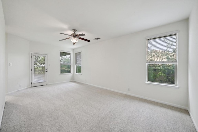 503 S Meadowlark St Unit B, Lakeway, TX 78734 - spare room with a ceiling fan, light carpet, and baseboards