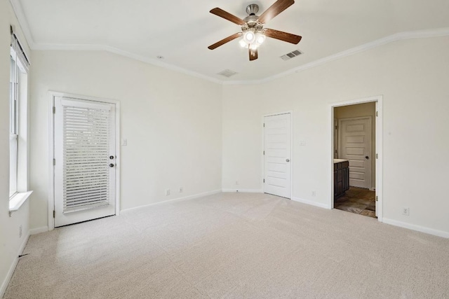 503 S Meadowlark St Unit B, Lakeway, TX 78734 - unfurnished bedroom with light colored carpet, crown molding, lofted ceiling, baseboards, and ensuite bathroom