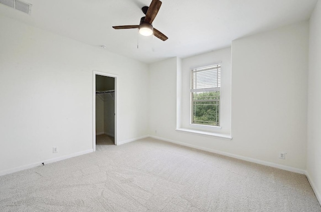 503 S Meadowlark St Unit B, Lakeway, TX 78734 - unfurnished bedroom with carpet floors, baseboards, ceiling fan, and a closet