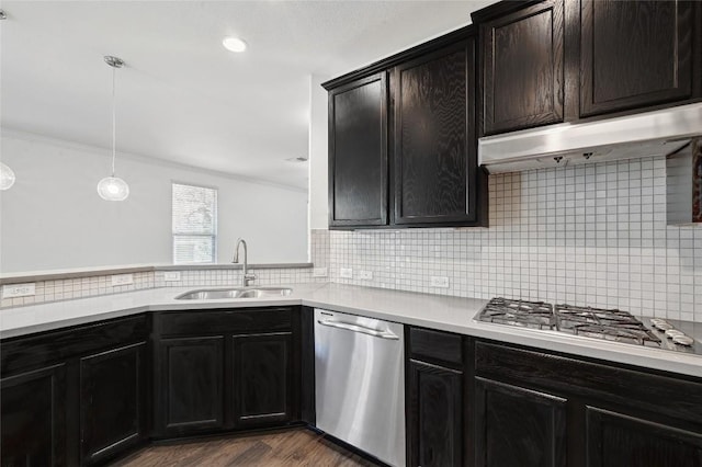 503 S Meadowlark St Unit B, Lakeway, TX 78734 - kitchen featuring appliances with stainless steel finishes, a sink, light countertops, decorative backsplash, and crown molding