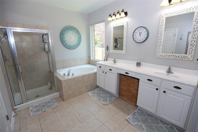 1401 Brixey Cv, Austin, TX 78754 - full bathroom with double vanity, a garden tub, tile patterned flooring, and a stall shower