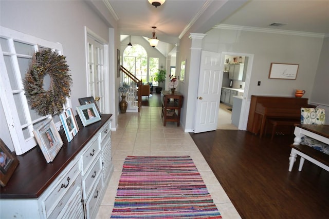 1401 Brixey Cv, Austin, TX 78754 - entrance foyer featuring light tile patterned floors and ornamental molding